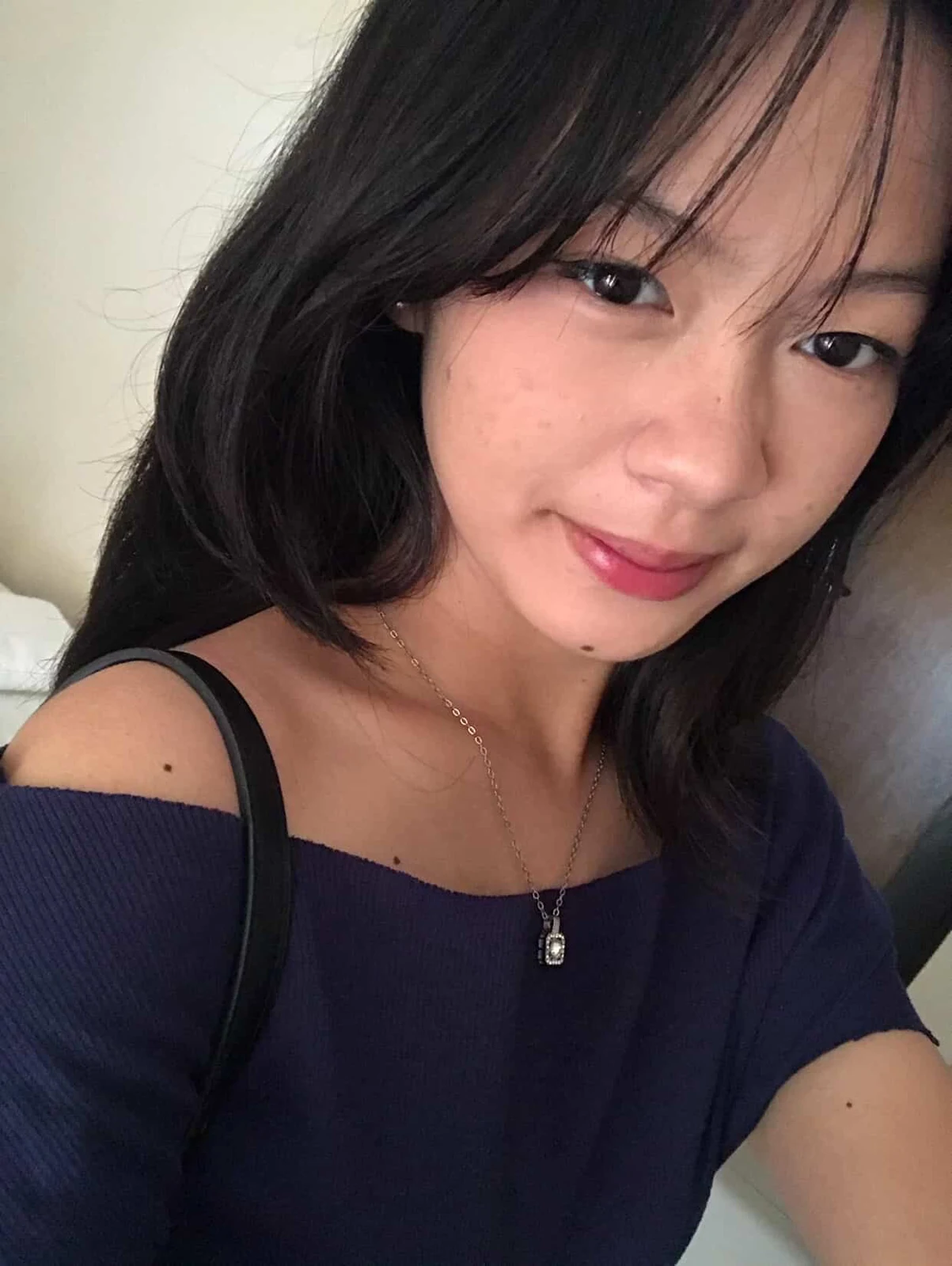 Gilly smiling in a navy top